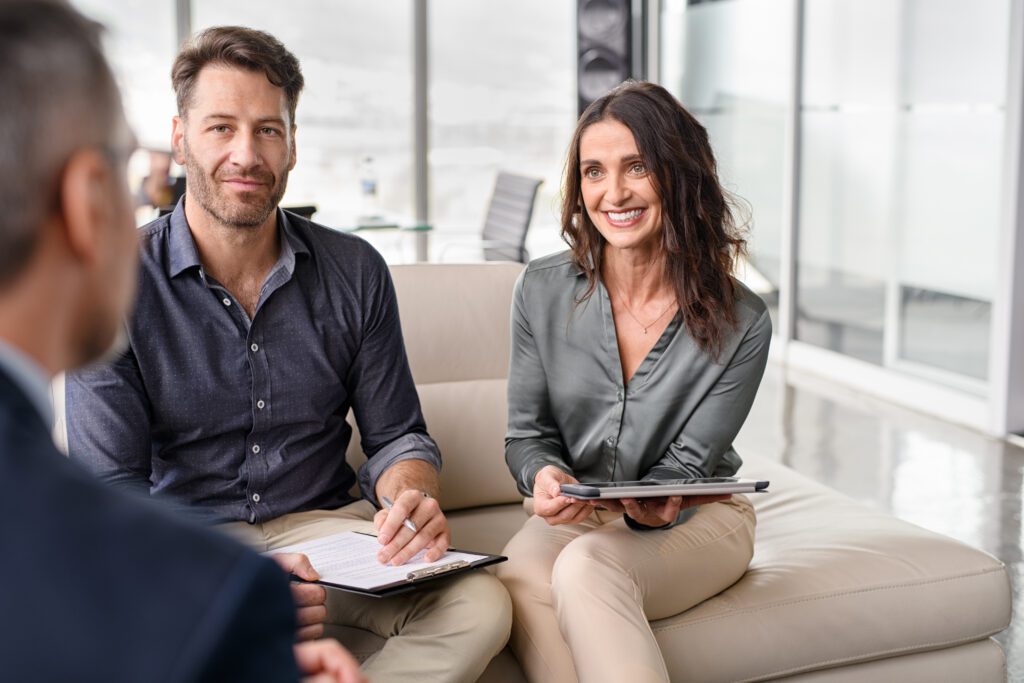 Professional business team listening to client during a meeting. Successful businessman and businesswoman listening to colleague at meeting. Happy business people meet togheter in office.