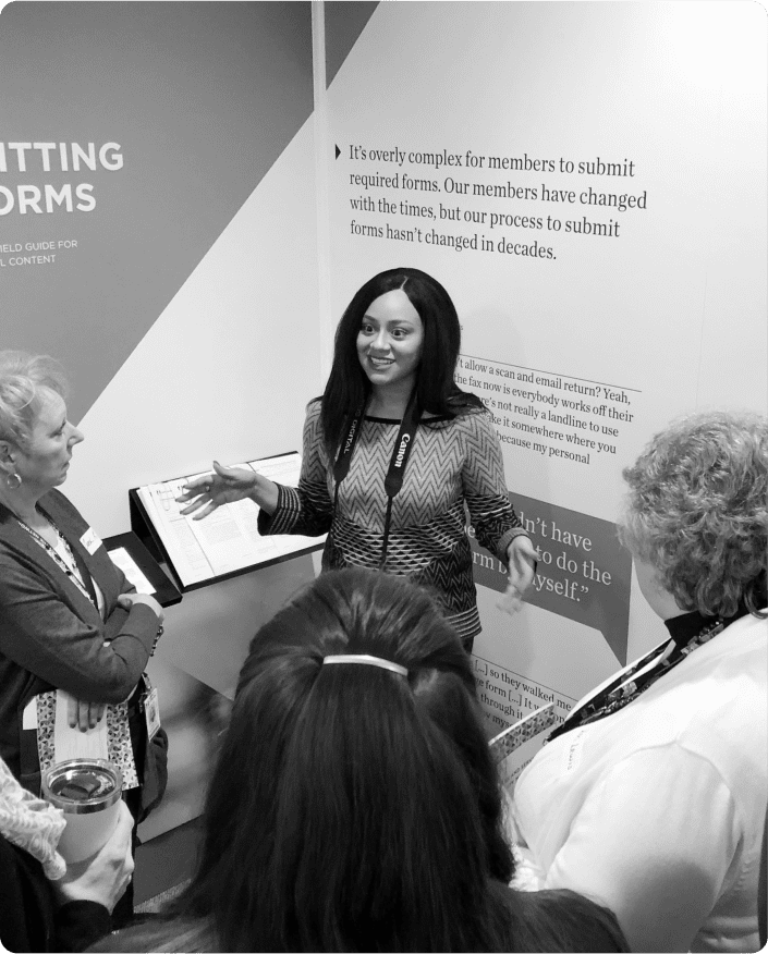 Woman presenting to a group in the Experience Room